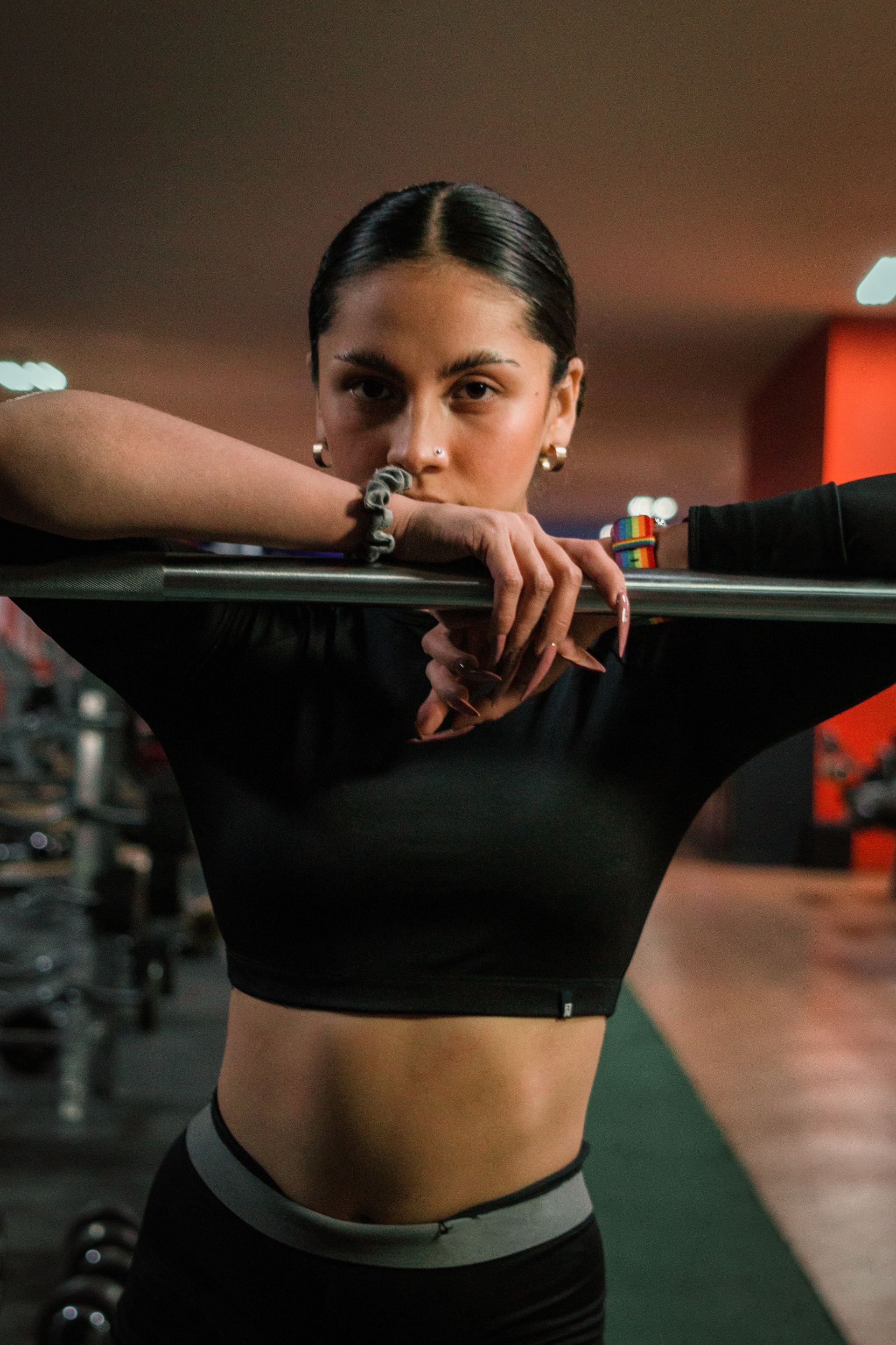 A woman taking a pause at a boxing ring