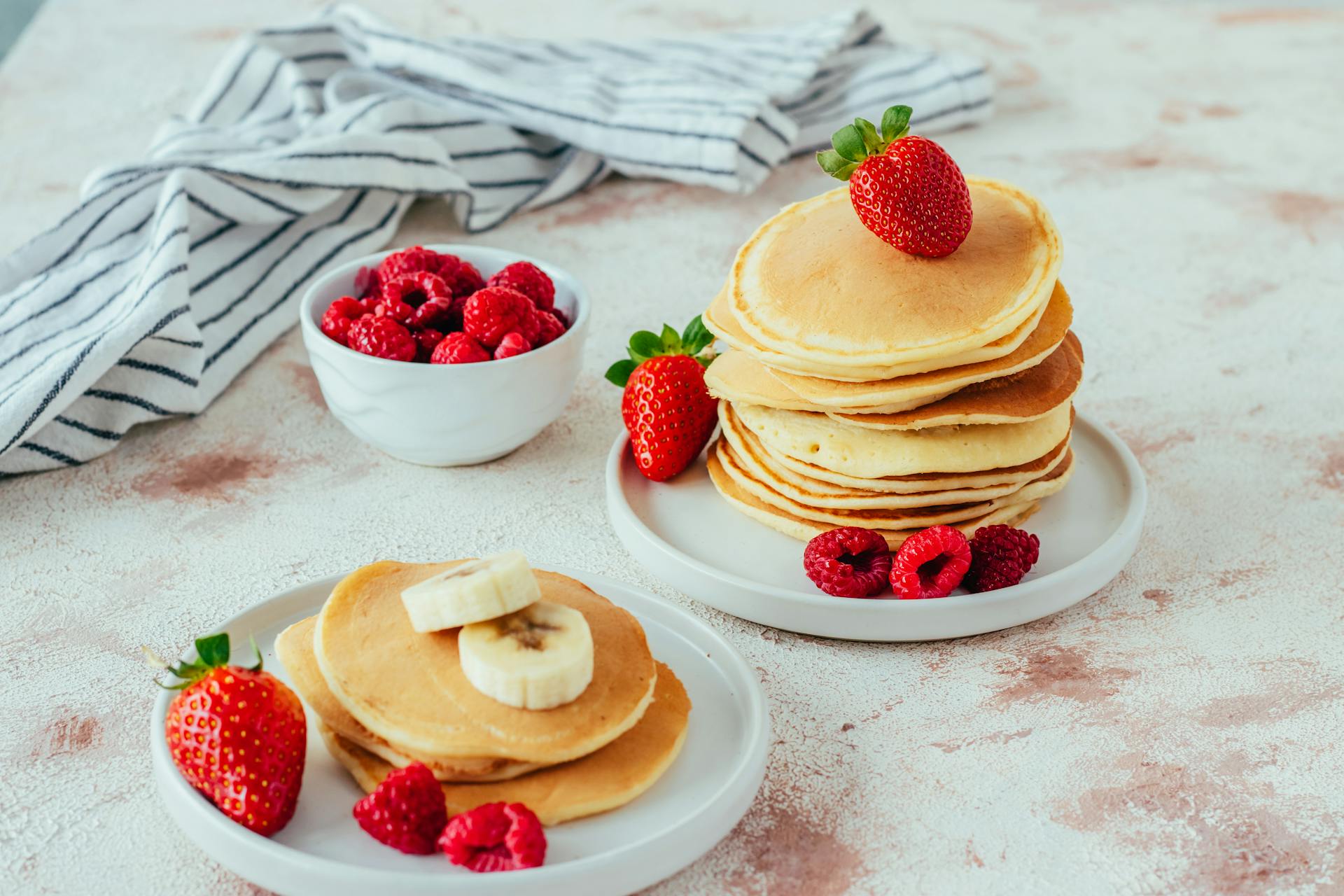 Pancakes with strawberries, raspberries and banana